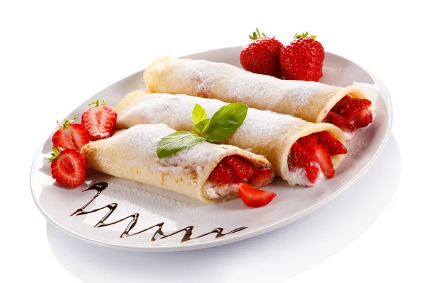 Pancakes with cream and strawberry Royalty Free Stock Photos