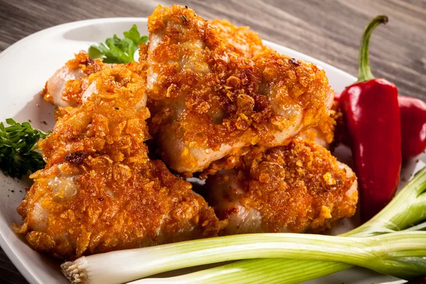 Roasted chicken wings with vegetables — Stock Photo, Image