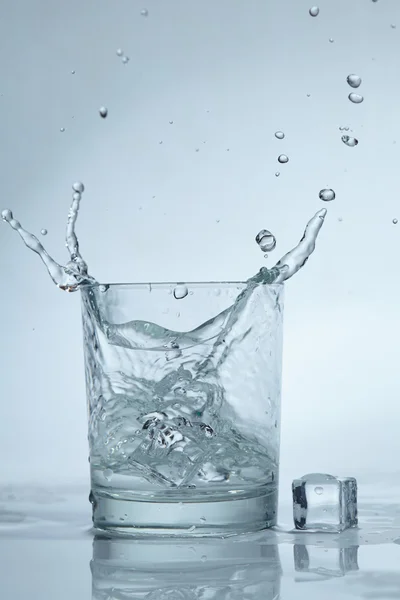 Ice cubes in water — Stock Photo, Image