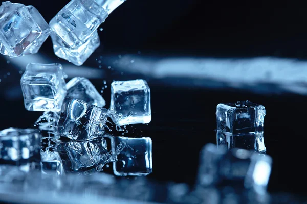 Ice cubes with water splash — Stock Photo, Image