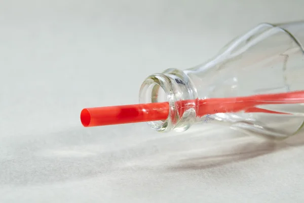 Soda bottle and tube — Stock Photo, Image