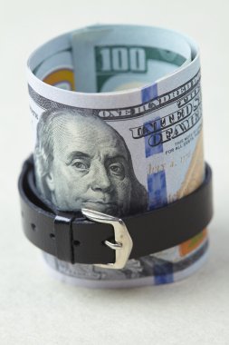 Belted roll of dollars clipart