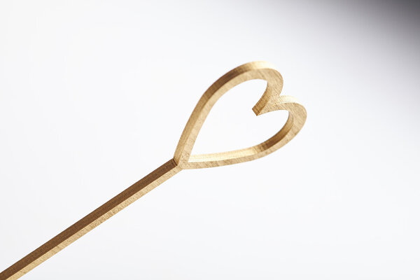 gold heart on stick 