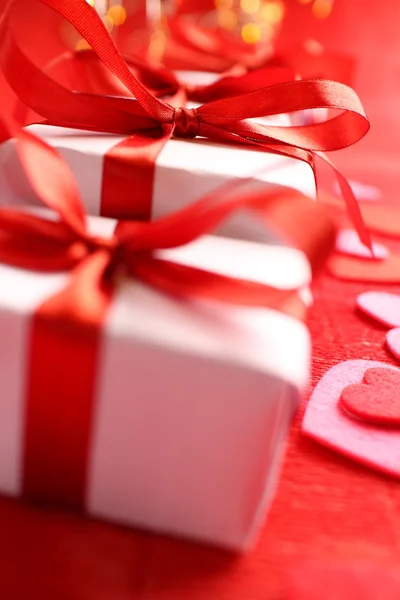 Gifts with red ribbons — Stock Photo, Image