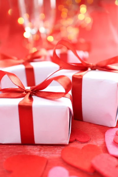 Gifts with red ribbons — Stock Photo, Image