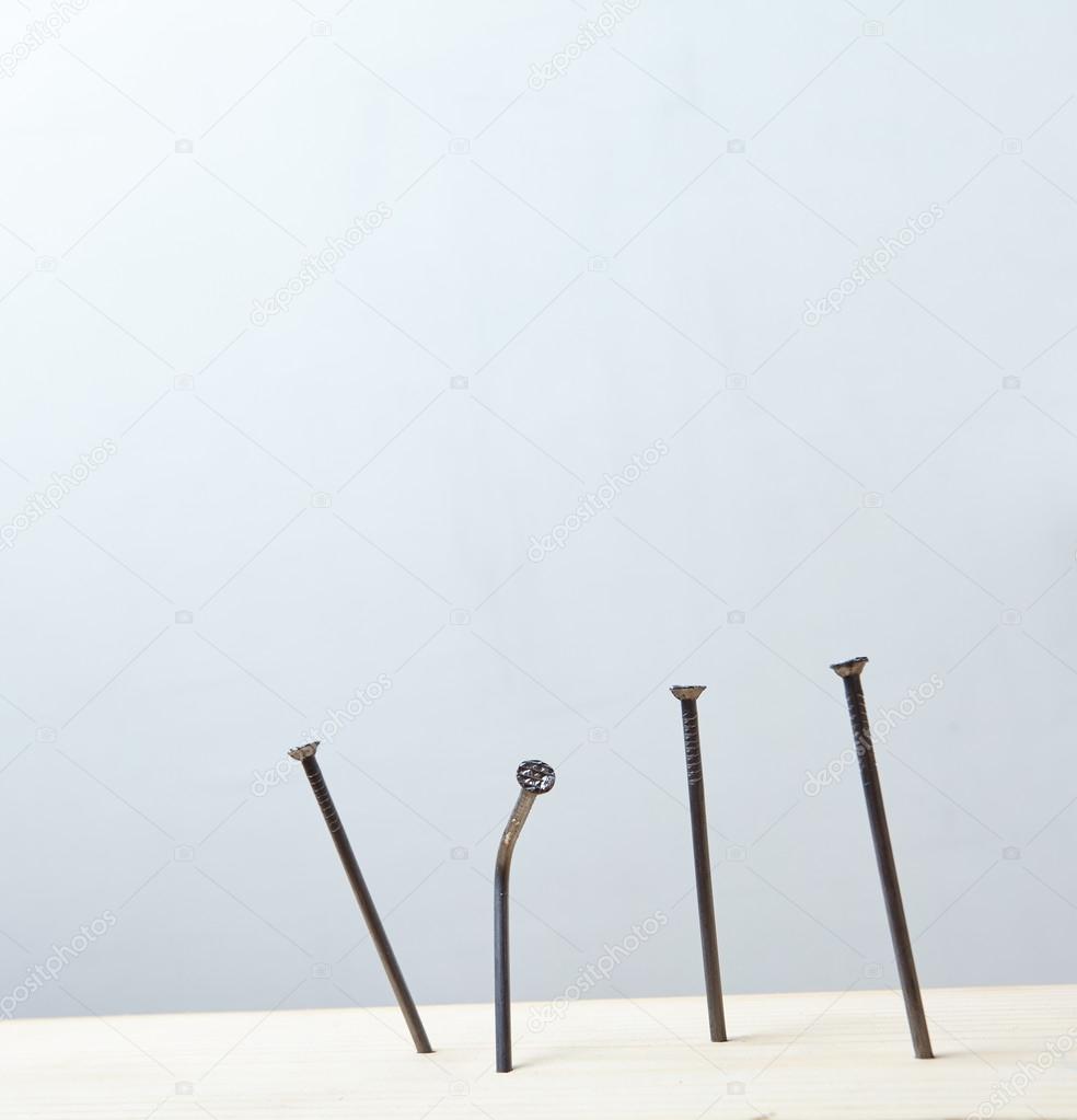 Nails on woodes panel Stock Photo by ©strelok 116163148