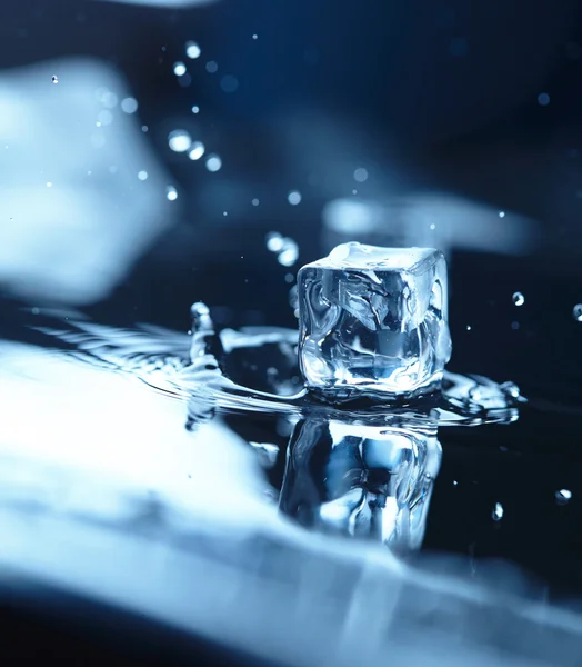 Ice cubes with water splash — Stock Photo, Image