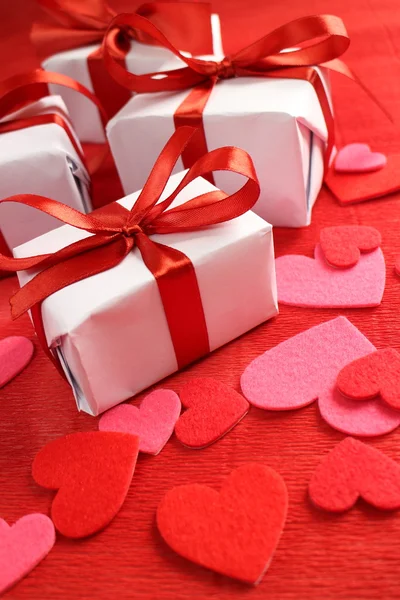 Gifts with  ribbons and hearts — Stock Photo, Image