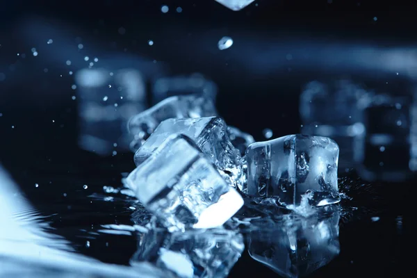 Ice cubes with water splash — Stock Photo, Image