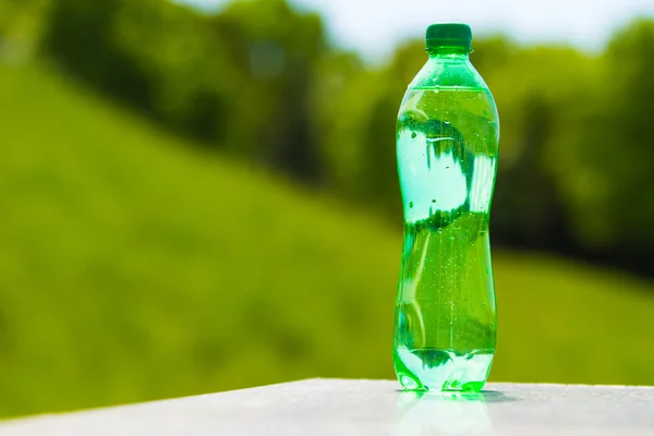 water in the green bottle