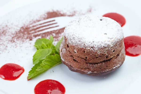 Chocolate dessert with mint and sauce — Stock Photo, Image