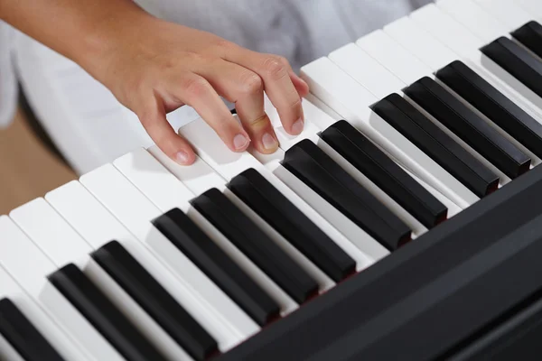Female's  hands playing piano — Stock Photo, Image