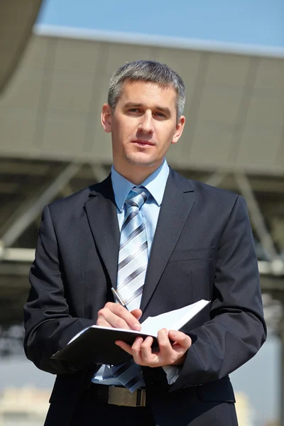 Businessman  with notebook — Stock Photo, Image