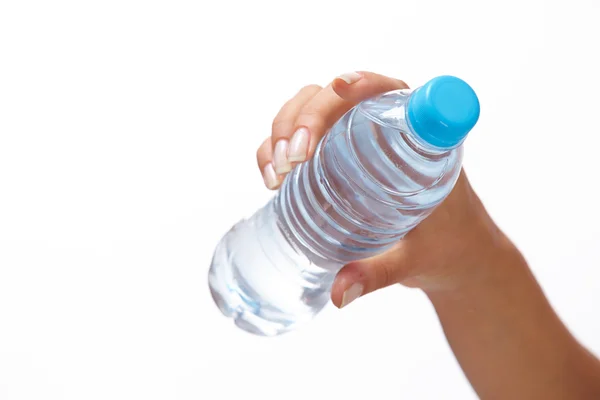 Bottle of water in hand — Stock Photo, Image