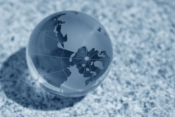 Glass globe on water — Stock Photo, Image