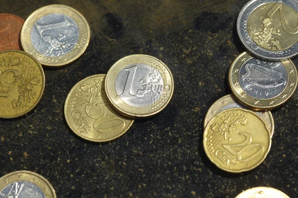 Coins under water — Stock Photo, Image