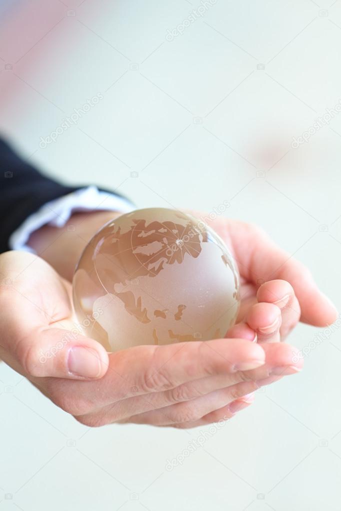 Glass ball in  hands