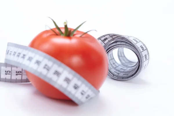 Fita métrica com tomate — Fotografia de Stock