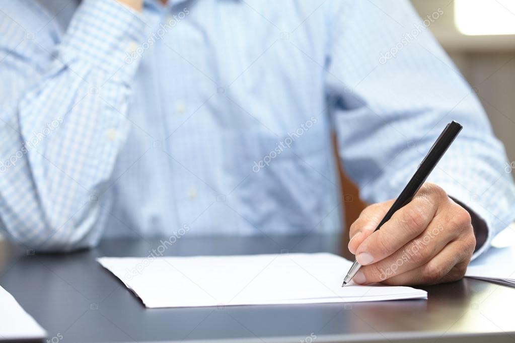 Man with pen and paper sheet