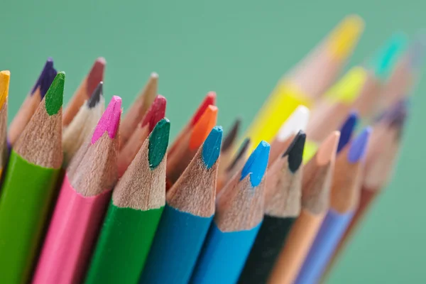 Color pencils on green — Stock Photo, Image