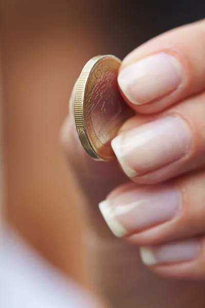 Woman handing coins — Stock Photo, Image