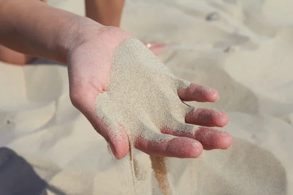 Hand pours sand Royalty Free Stock Images