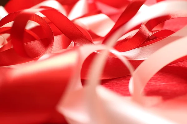 Ribbons on the red background — Stock Photo, Image