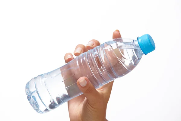 Woman hand with bottle of water — Stock Photo, Image