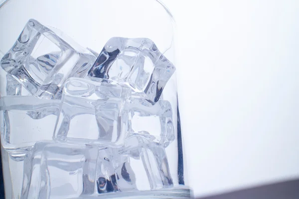 Glass with ice cubes — Stock Photo, Image