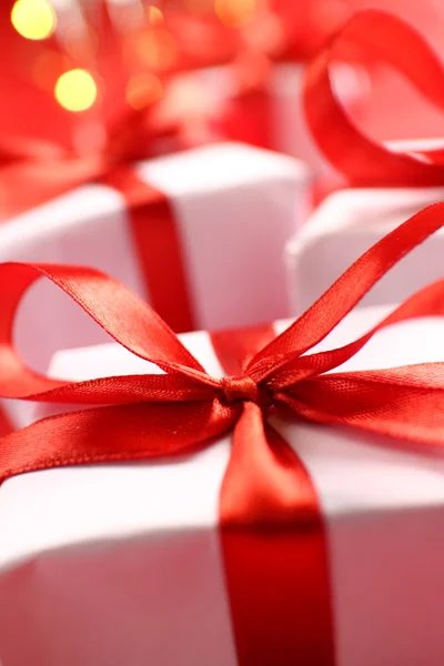 Gifts with red ribbons — Stock Photo, Image