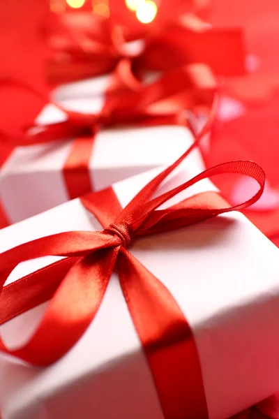 Gifts with red ribbons — Stock Photo, Image