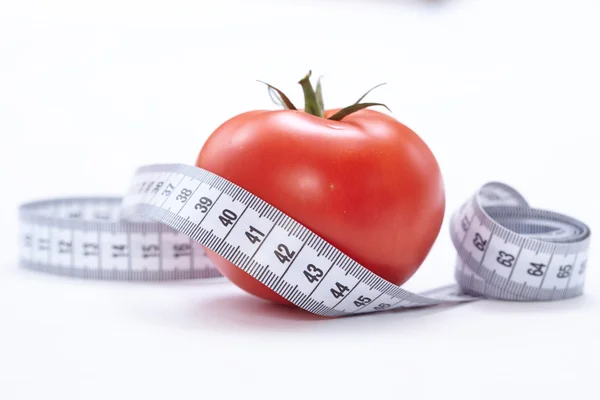 Fita métrica com tomate — Fotografia de Stock