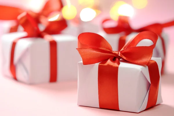 Gifts with red ribbons — Stock Photo, Image