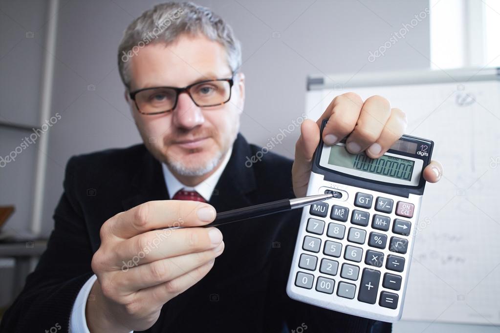 Portrait of Businessman with calculator