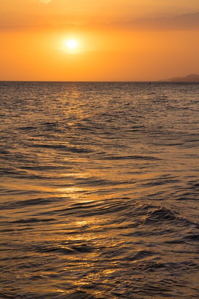 Sunset over calm sea