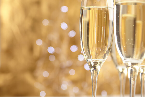 Champagne glasses on gold background