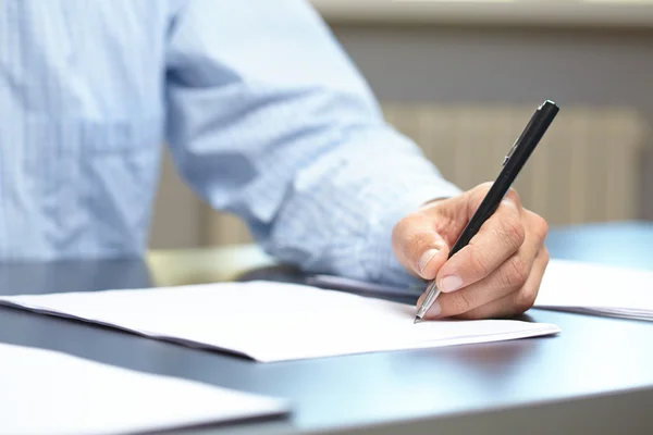 Man with pen in hand Stock Picture