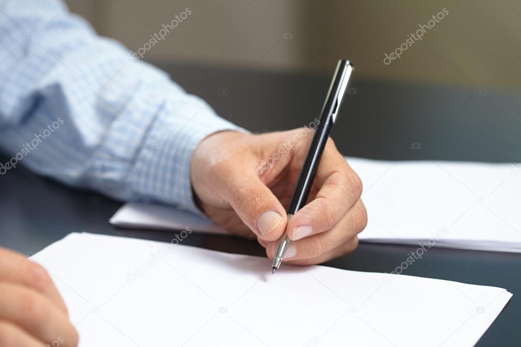 Man with pen in hand