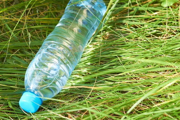 Bottle of water on grass