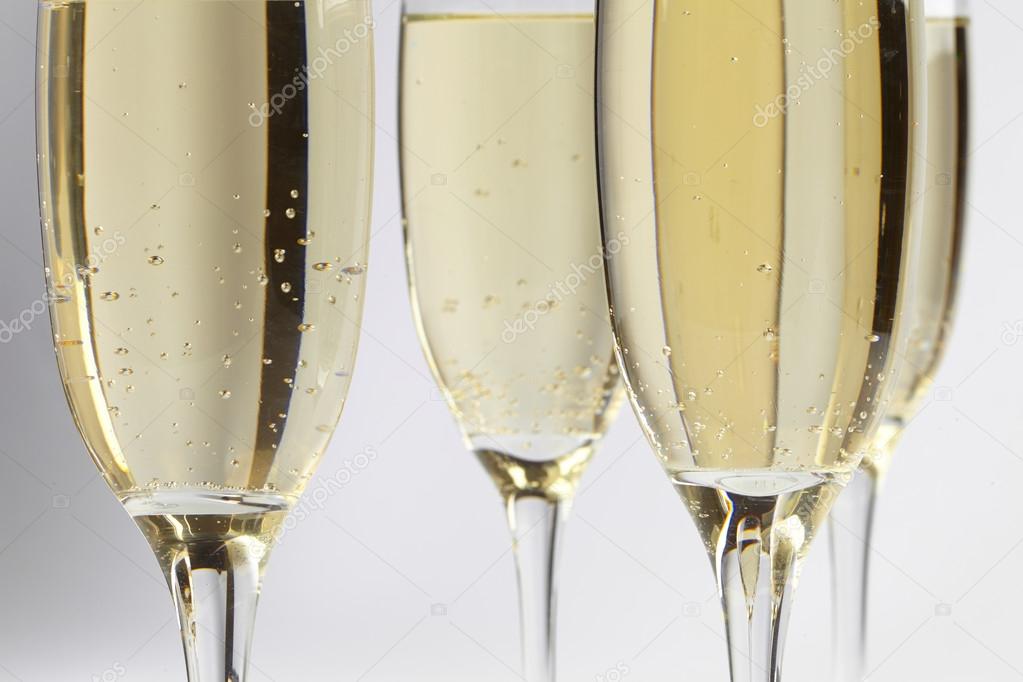 Champagne glasses on white