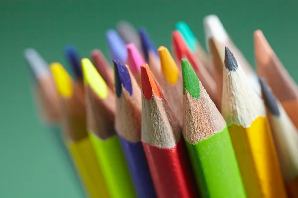 Color pencils against green background — Stock Photo, Image