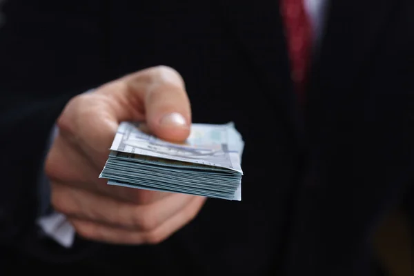 Businessman holding money — Stock Photo, Image