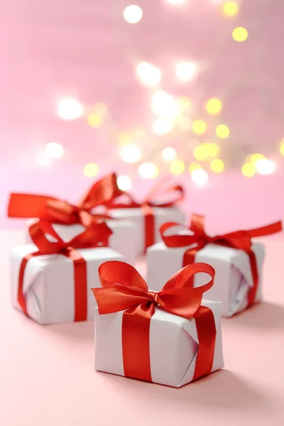 Gifts with red ribbons — Stock Photo, Image