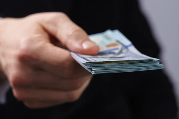 Businessman holding money — Stock Photo, Image