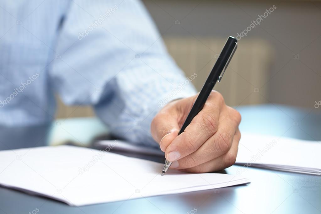 Man with pen in hand