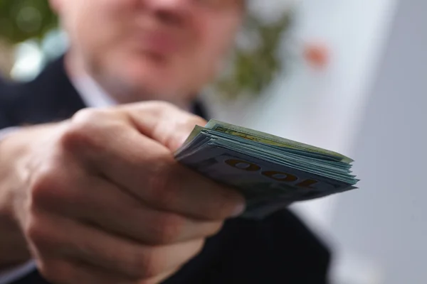 Businessman with counting money — Stock Photo, Image