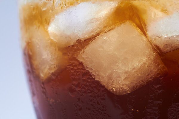 Cola with ice cubes