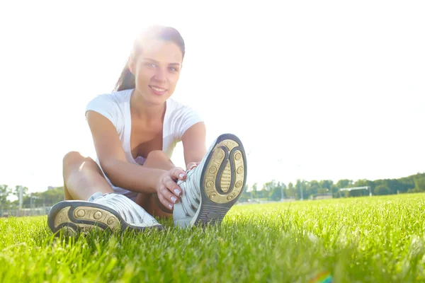 Young woman do sport on a play-ground — Stock Photo, Image