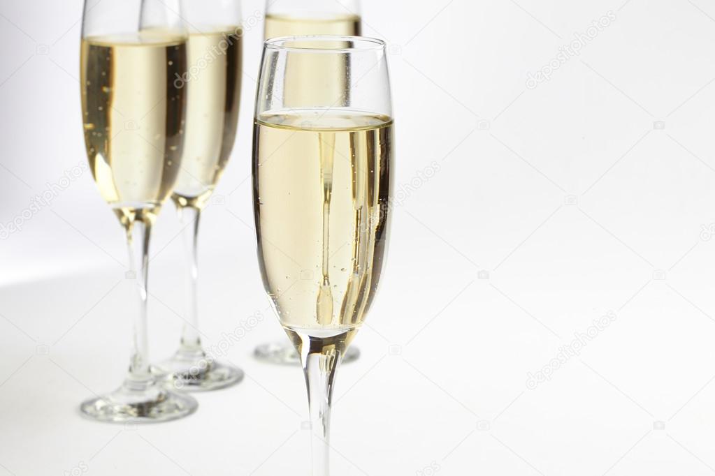 Champagne glasses on white
