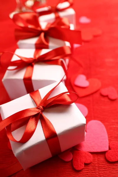 Gifts with red ribbons — Stock Photo, Image